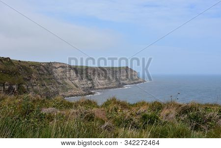 Rugged Landscape And Sea Cliffs Of Robin Hood's Bay