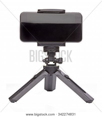 Small Black Tripod For Smartphone Isolated On White Background. Close Up.