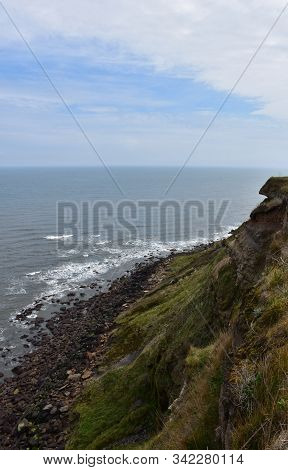 A View Down The Coastal Sea Cliffs In England.