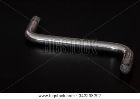 Hexagon Socket Screw Allen Key In A Black Background Isolated