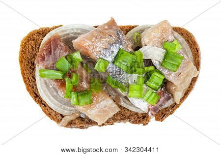 Top View Of Open Sandwich With Rye Bread, Pickled Herring And Onion Isolated On White Background