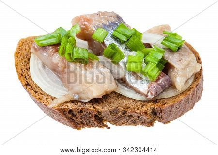 Open Sandwich With Rye Bread, Pickled Herring And Onion Isolated On White Background