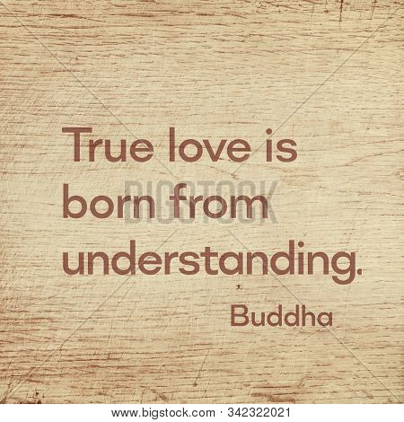 True Love Is Born From Understanding - Famous Quote Of Gautama Buddha Printed On Grunge Wooden Board