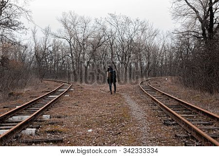 A Man On The Railway Steps On A Journey From Hustle And Bustle. Stock Photo.
