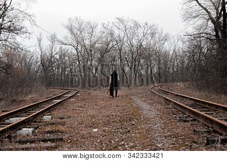 A Man On The Railway Steps On A Journey From Hustle And Bustle. Stock Photo.