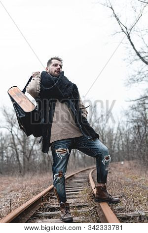 A Man On The Railway Steps On A Journey From Hustle And Bustle. Stock Photo.