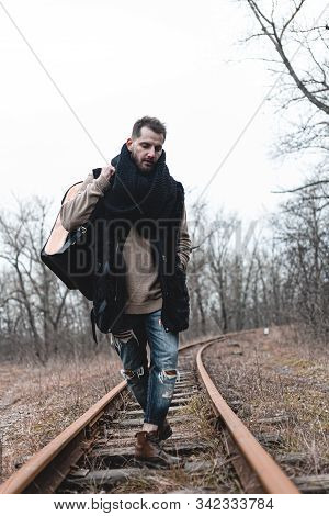 A Man On The Railway Steps On A Journey From Hustle And Bustle. Stock Photo.