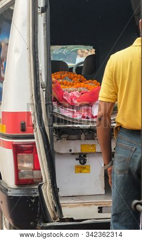 The Dead Body Of An Elderly Indian Woman Is Delivered By Ambulance At Swargadwar Crematorium In Puri