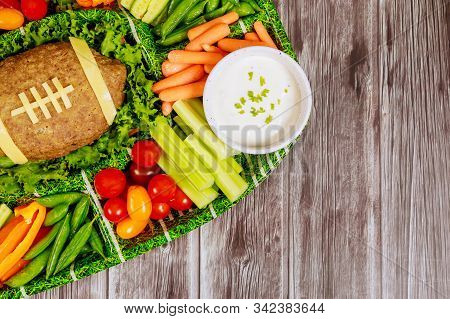 Colorful Vegetable Platter With Meatloaf Like A Football Ball And Dipping Ranch For Football Watchin
