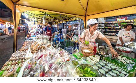 Krabi Town, Thailand - November 23 2019: A Local Woman Selling Street Food In Krabi Weekend Night Ma
