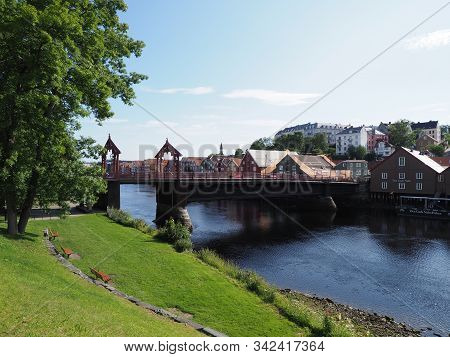 Trondheim, Norway On July 2019: View To Town Bridge And Traditional Buildings At Nidelva River In Eu