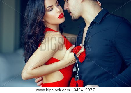 Erotic Milf Woman In Red Dress, Lips, Holding Handcuffs, Seducing Young Lover, Holding Handcuffs, Bd