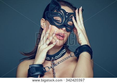 Sensaul Young Brunette Woman In Catwoman Mask And Leather Handcuffs Portrait, Bdsm