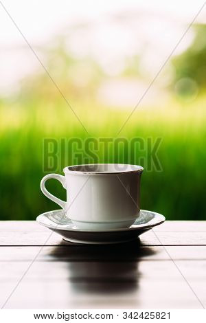 White Tea Cup On A Beautiful Background. White Coffee Cup On The Background Of Rice Terraces In Bali