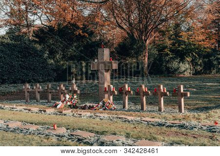 Hamburg, Germany - November 9, 2019: Tomb Stone Cross In Graveyeard In Ohlsdorf Cemetery During Fall