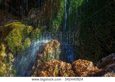 The Process Of Formation Of Stalagmites In A Karst Cave Under A Waterfall.