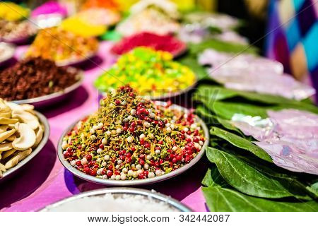 Different Types Of Colorful Garnish Pan Masala Used To Decorate Betel Leaf Banarasi Paan.