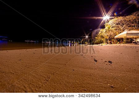 Night View Of Loh Dalum Beach In Phi Phi Islands, Thailand. Sea And Lights.