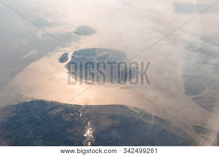 Aerial View Of The Magnificent Bramhaputra River In Bangladesh From The Airplane. Selective Focus.
