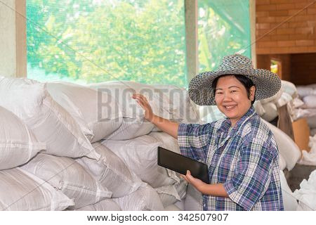 Asian Woman Smart Farmer Agriculturist Happy At A Fertilizer Composting Plant With Organic Fertilize