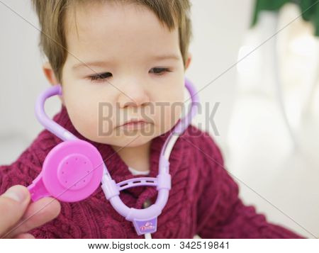 Childrens And Phonendoscope. Little Kid Boy With Phonendoscope Playing Doctor. Healthcare And Medici