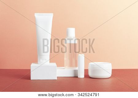 Women Skincare Products Blank Packages Composition On Pink Background. Unbranded Nail Polish Remover