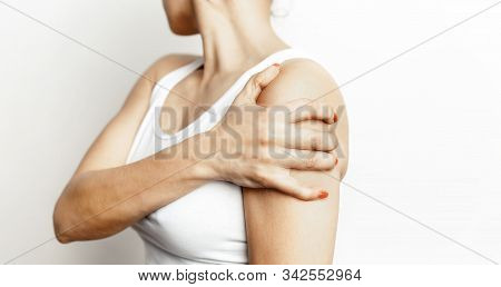 Acute Shoulder Pain. Hand Touch The Painful Point. Pain Area Highlighted In Red. Healthcare And Medi