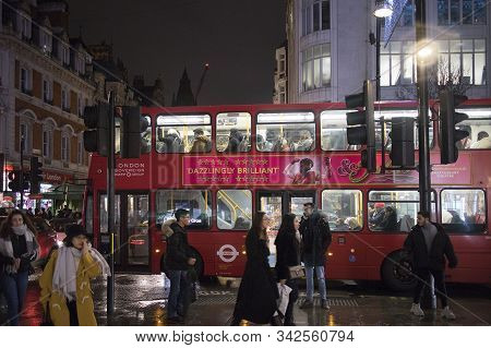 Busy London Street Scene At Oxford Circus With British Flags Decorating Regent Street, A Landmark Re