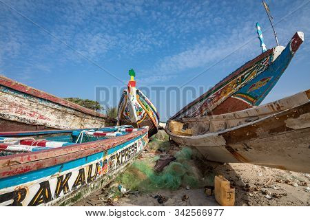 Tanji, The Gambia - November 21, 2019: Traditional Fishing Boats In Tanji. Fishing Village. Gambia,
