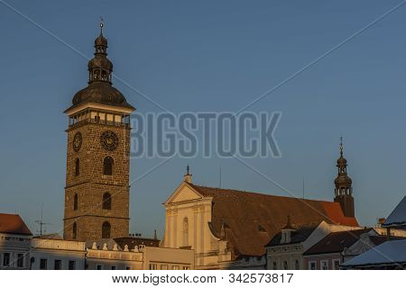 Centre Of Ceske Budejovice City With Old Houses And Towers And Rivers In Sunny Winter Evening