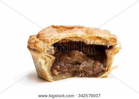 Puff  Pastry Steak Pie On Baking Paper Isolated On White