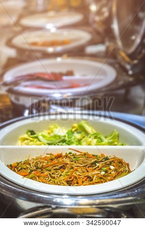 Fried Noodles And Boiled Pakchoy In A Serving Bowl As A Asian Style Breakfast Buffet On The Table In