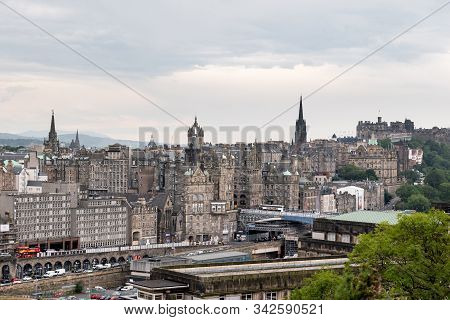 Edinburgh, Scotland - July 30, 2019: The Cityscape Of Edinburgh City With Waverley Train Station, Ol