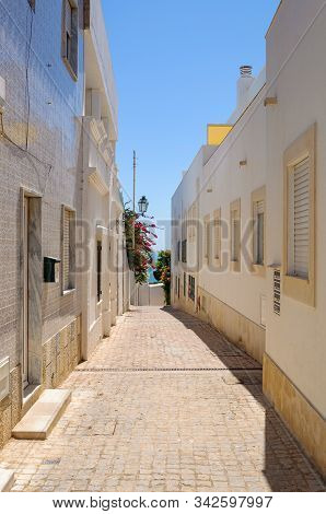 Picuresque Narrow Street In Albufeira, Algarve, Portugal