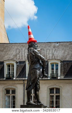 Rennes, France - July 23, 2018: Bronze Statue Vandalized With A Traffic Cone On His Head, Place Du C