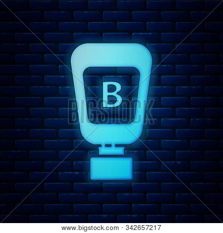 Glowing Neon Sauce Bottle Icon Isolated On Brick Wall Background. Ketchup, Mustard And Mayonnaise Bo
