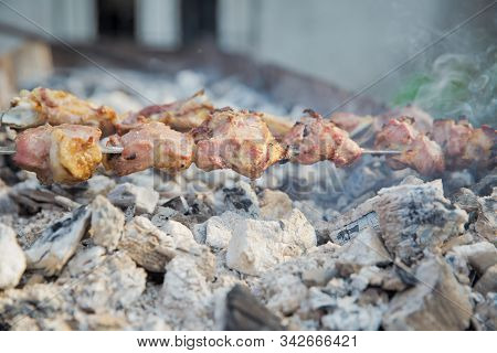 Appetizing Lula Kebab Grilled On Metal Skewer. Hand And Swallow Kebab Swab. Shish Kebab On A Metal S