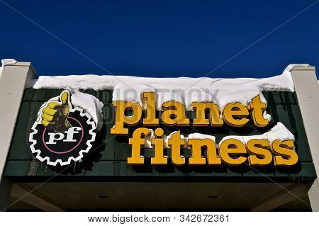 Moorhead, Minnesota, December 30, 2019: The Snow Covered Logo Is From Planet Fitness, An American Fr