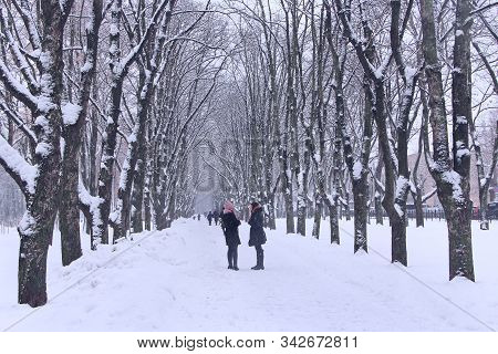 Chernihiv / Ukraine. 05 January 2019: 
Two Girlfriends Have Conversation In Winter Park During Snowf