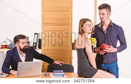 Taking A Lunch Break. Business Partners Enjoying Conversation In Lunch Break While Colleague Working