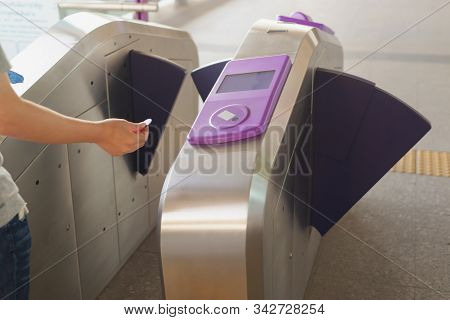 Passenger Use Coin Ticket Touch With The Automatic Access Barrier