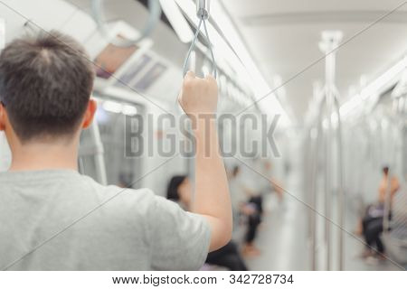 City Living Concept Male Hand Holding A Looped Handle In Urban Public Transportation