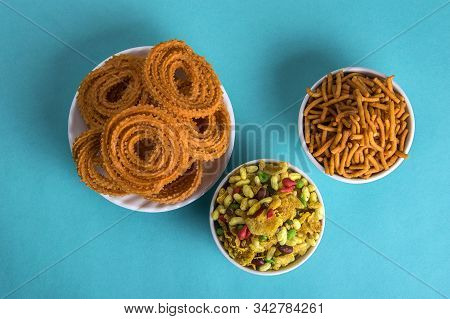 Indian Snack : Chakli, Chakali Or Murukku And Besan (gram Flour) Sev And Chivada Or Chiwada On Blue