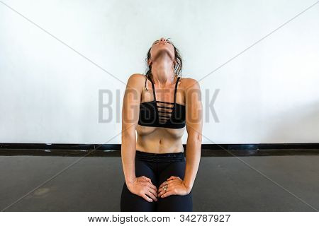 A Front View Of A Healthy Caucasian Lady In A State Of Deep Meditation And Prayer, Sitting On Floor 