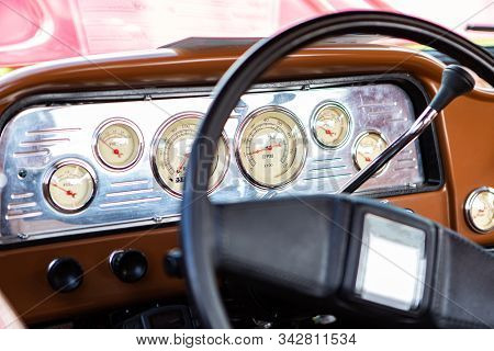 Classic Antique Car Black Steering Wheel And Brown Dashboard Close Up, Simple Old Style Cars Interio