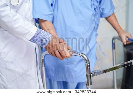 Doctor Help Asian Senior Or Elderly Old Lady Woman Patient Walk With Walker At Nursing Hospital Ward
