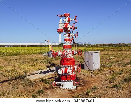 Well For Oil And Gas Production. Oil Well Wellhead Equipment. Oil Production.