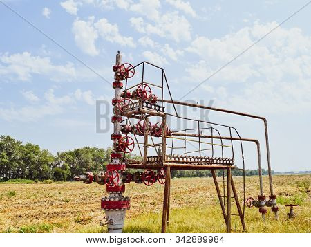 Well For Oil And Gas Production. Oil Well Wellhead Equipment. Oil Production.