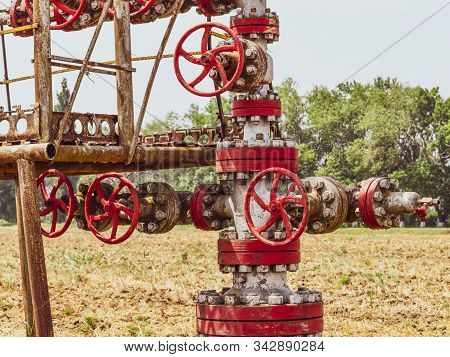 Well For Oil And Gas Production. Oil Well Wellhead Equipment. Oil Production.