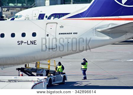 Warsaw,poland. 18 March 2018. Warsaw Chopin Airport. The Plane At The Airport On Loading. Plane Line